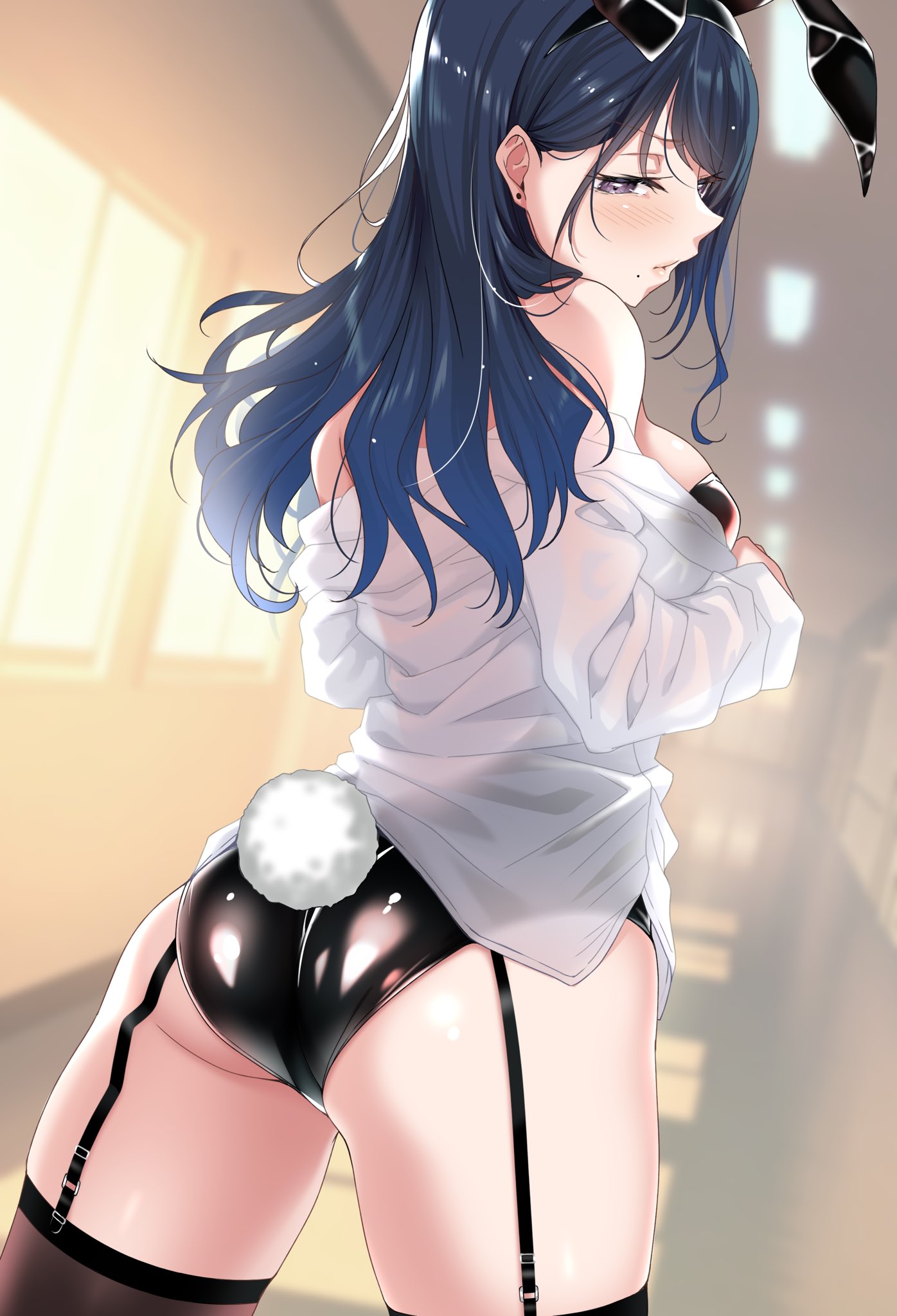 1girl animal_ears ass bare_shoulders black_leotard blue_hair blurry blurry_background blush breasts brown_thighhighs cowboy_shot depth_of_field dutch_angle earrings fake_animal_ears fake_tail from_behind garter_straps half-closed_eye hario_4 highres indoors jewelry kurosawa_mitsuki leotard leotard_under_clothes long_hair long_sleeves looking_at_viewer looking_back medium_breasts mole mole_under_mouth mondaiji_no_watashitachi_wo_kaeta_no_wa_onaji_class_no_monaka-senpai off_shoulder playboy_bunny purple_eyes rabbit_ears rabbit_tail see-through shirt solo standing stud_earrings tail thighhighs thighs white_shirt window