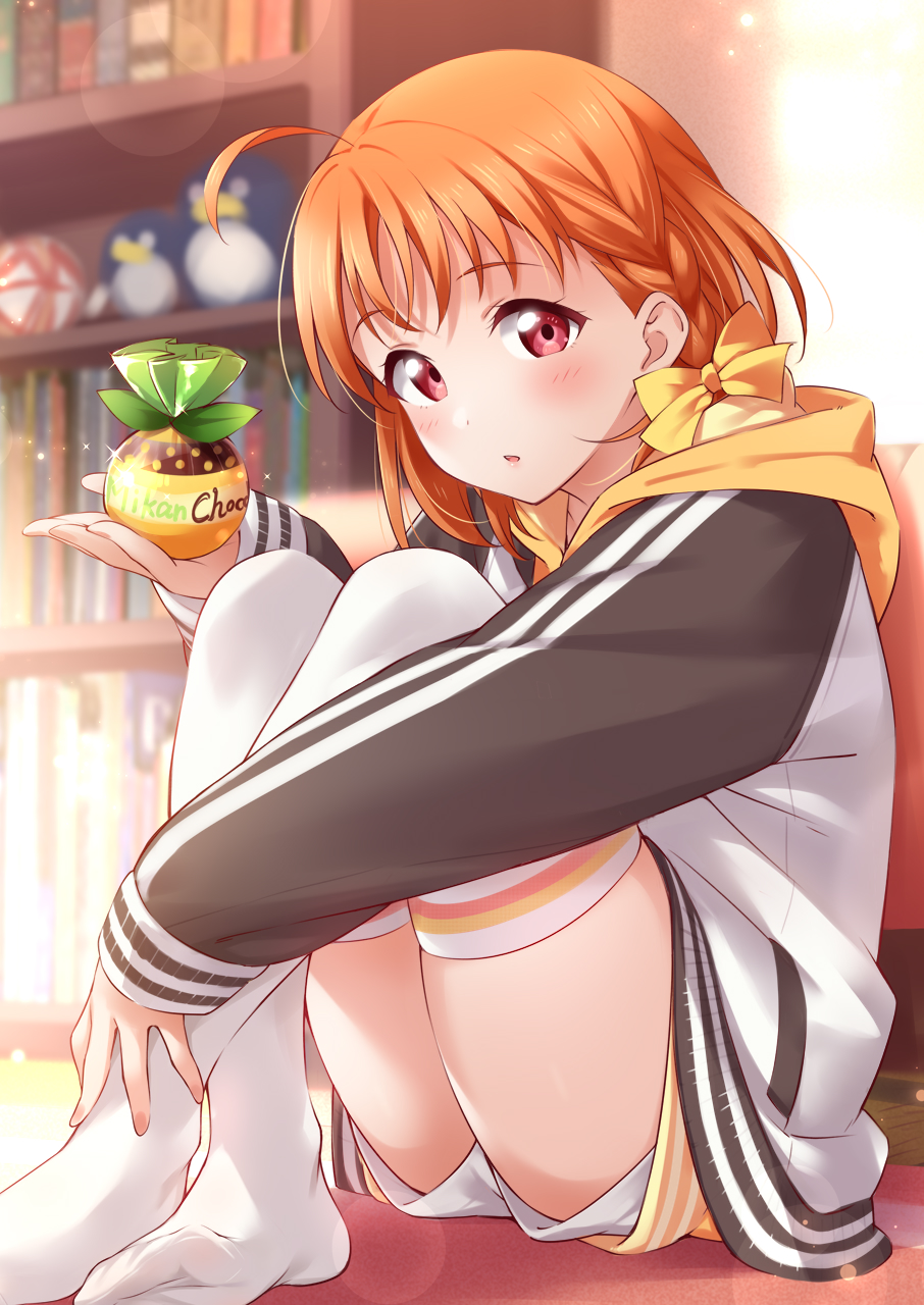 1girl ahoge blurry blurry_background blush braid clover_hair_ornament crossed_legs hair_ornament highres holding hood indoors inou_shin long_sleeves looking_at_viewer love_live! love_live!_sunshine!! open_mouth orange_hair red_eyes ribbon short_hair short_shorts shorts side_braid sitting solo takami_chika thighhighs white_thighhighs yellow_ribbon