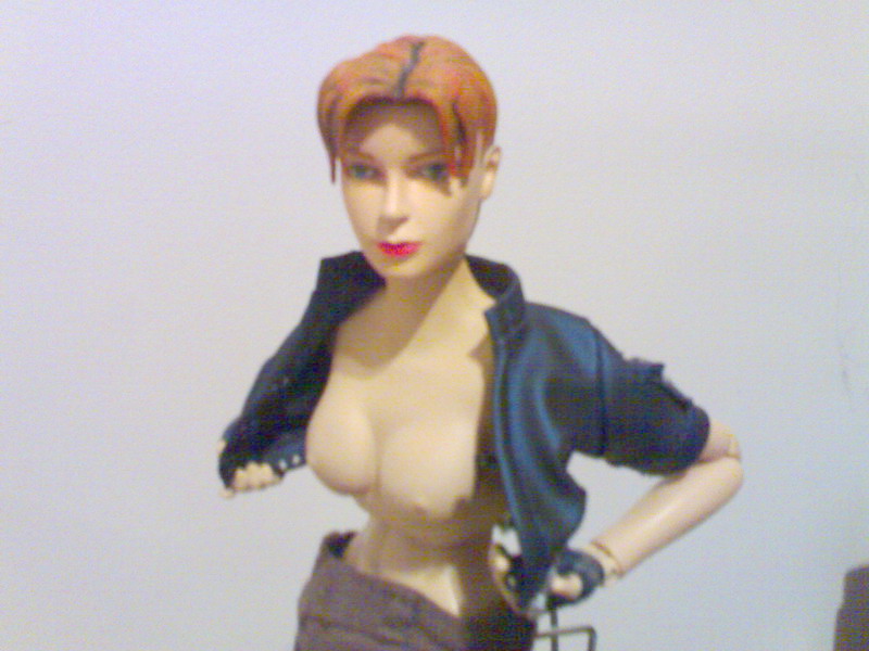 blue_eyes breasts breasts_outside brown_hair bukkake cropped_jacket cum doll_joints figure fingerless_gloves gloves jacket joanna_dark large_breasts lipstick makeup nipples no_bra open_clothes open_jacket pants perfect_dark photo semen_on_figure short_hair simple_background slender_waist solo undressing upper_body white_background