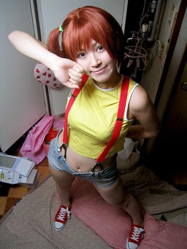 cosplay denim denim_shorts from_above kasumi_(pokemon) looking_at_viewer no_socks photo pokemon ponytail red_hair shoes shorts side_ponytail smile sneakers solo sumomo_(sumomonger) suspenders