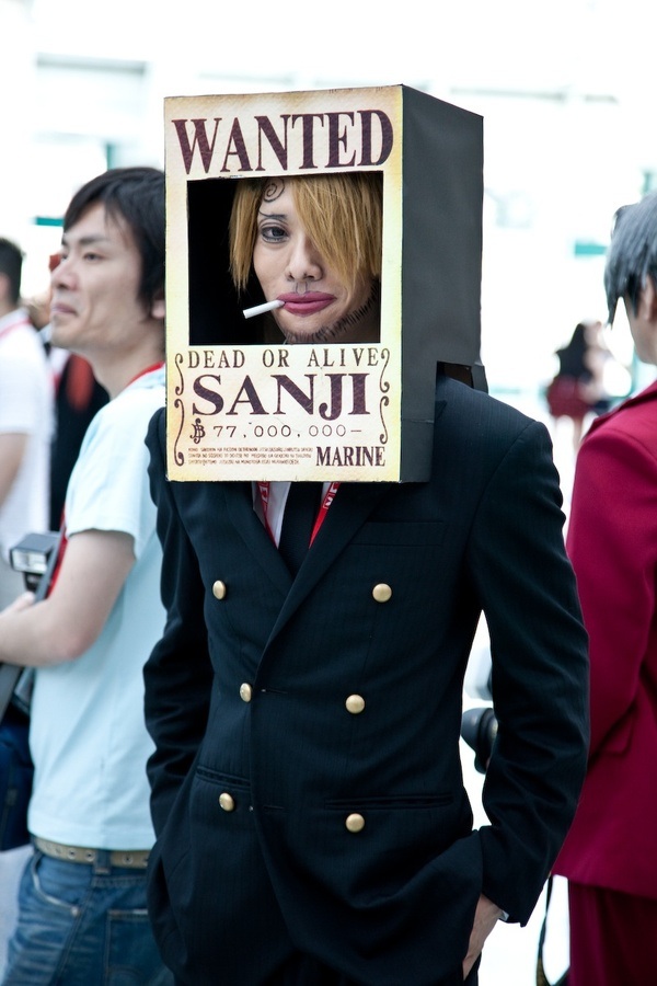ace_attorney blonde_hair capcom character_name comedy cosplay formal gyakuten_saiban hands_in_pockets humor looking_at_viewer male male_focus miles_edgeworth mitsurugi_reiji one_piece photo sanji sanji_(cosplay) suit ugly wanted wanted_poster
