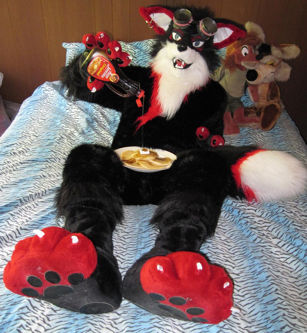 bed bedroom canine chest_fluff chest_tuft claws eyewear food fox fur fursuit goggles griefer looking_at_viewer male mammal open_mouth pancake paws piercing plushie real solo suggestive syrup tuft unknown_artist what