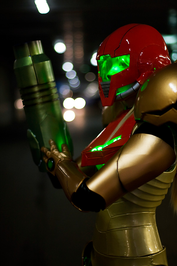 1girl arm_cannon armor cosplay helmet metroid neon_trim nintendo photo pixel_ninja power_armor samus_aran varia_suit weapon