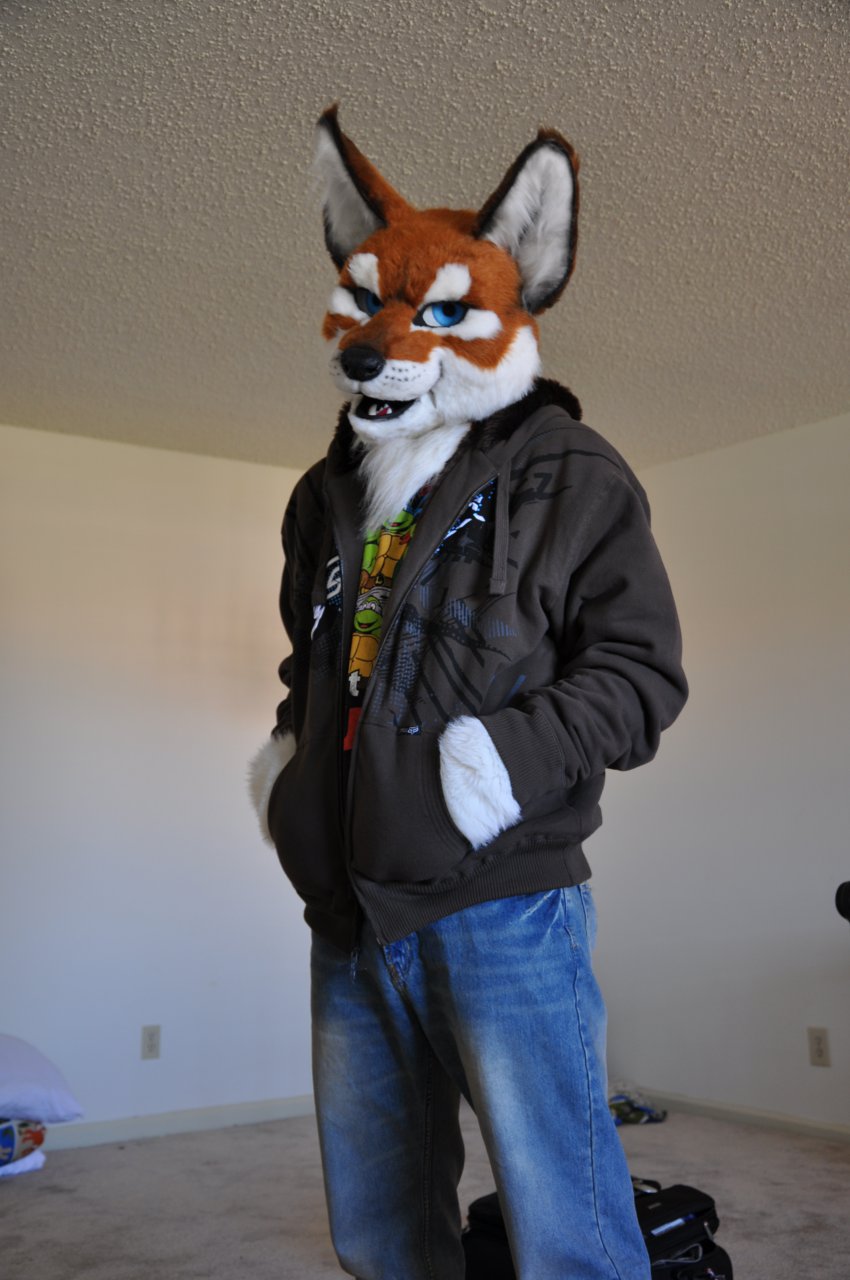 blue_eyes blue_jeans canine chest_tuft clothed clothing folf fox fur fursuit hoodie hybrid jeans junowolf male mammal onefurall photo pose real smile solo standing tuft wolf