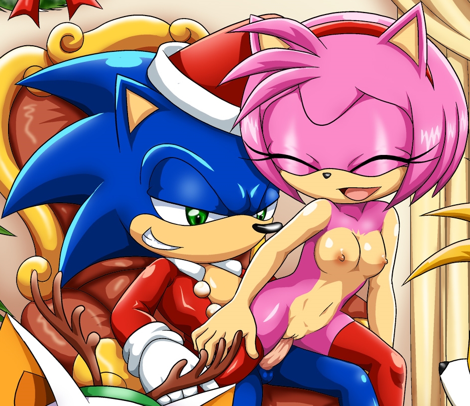 amy_rose bbmbbf breasts christmas clothing gloves happy hat holidays legwear mobius_unleashed palcomix penis pussy rouge_the_bat santa_hat sitting_in_lap small_breasts smile sonic_(series) sonic_the_hedgehog stockings