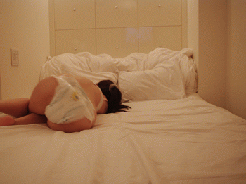 1girl animated animated_gif asian bed black_hair diaper nappy photo rolling solo