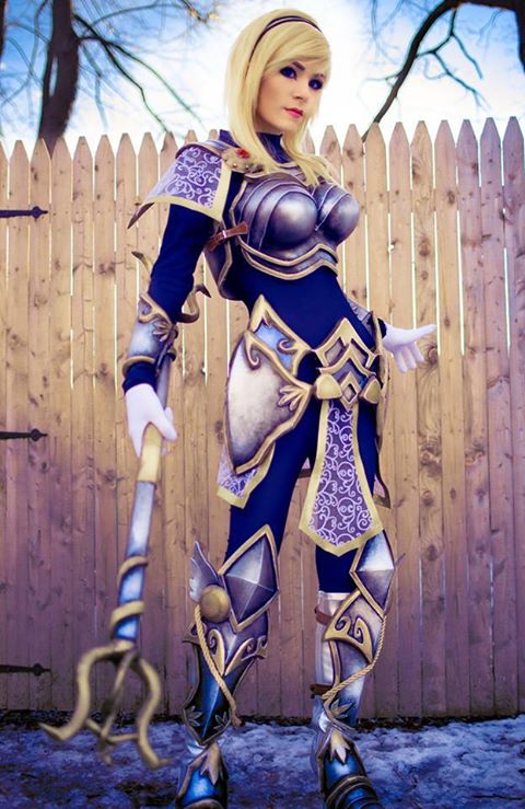 1girl armor blonde_hair bodysuit boots cosplay danielle_beaulieu hair_ornament league_of_legends lipstick looking_at_viewer luxanna_crownguard make_up outdoor staff tagme