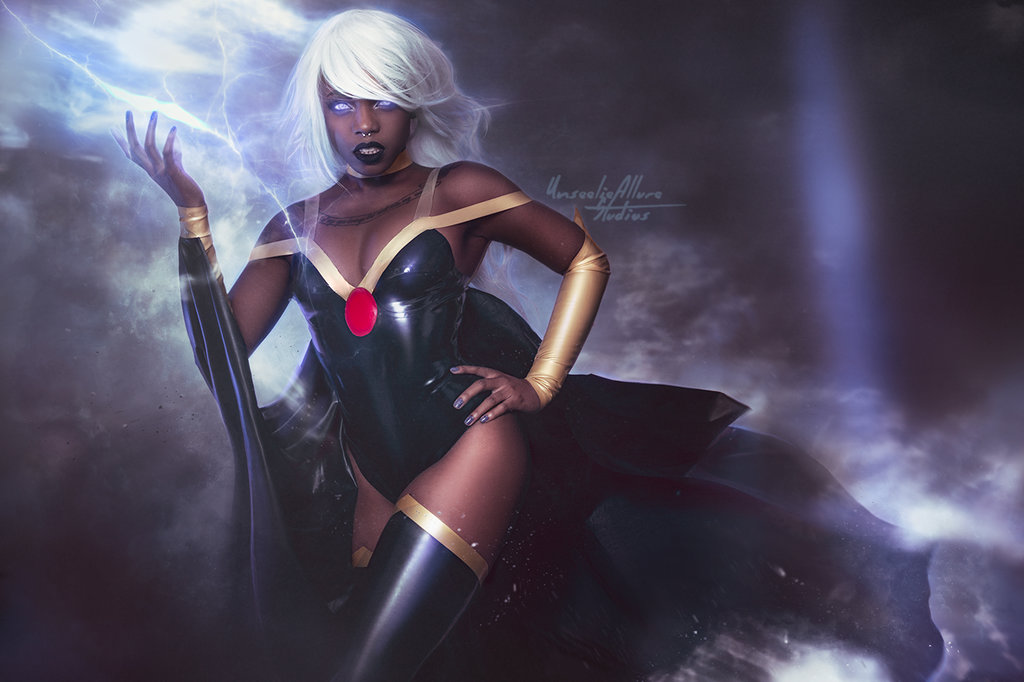 1girl breasts cape cosplay dark_skin energy glowing glowing_eyes lightning looking_at_viewer marvel_comics non-asian nose_piercing photo piercing storm_(x-men) white_hair x-men