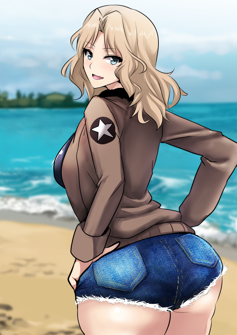 beach blonde_hair blue_eyes blue_shorts blurry blurry_background brown_jacket cloud cloudy_sky cowboy_shot cutoffs day denim denim_shorts depth_of_field emblem eyebrows_visible_through_hair from_behind girls_und_panzer hair_intakes hands_on_hips highres jacket kay_(girls_und_panzer) koujun_(mugenzero) long_hair long_sleeves looking_at_viewer military military_uniform ocean open_mouth outdoors saunders_military_uniform short_shorts shorts sky smile solo standing star uniform