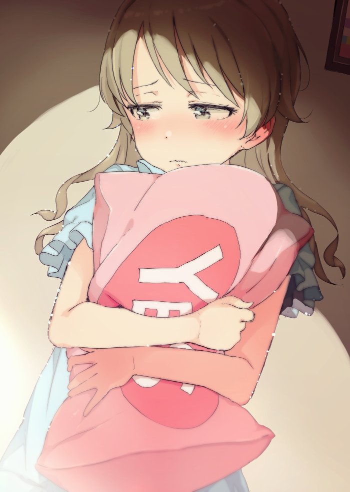 bangs blue_shirt blush brown_eyes closed_mouth commentary_request eyebrows_visible_through_hair gomennasai idolmaster idolmaster_cinderella_girls indoors light_brown_hair long_hair looking_away looking_to_the_side morikubo_nono picture_frame pillow pillow_hug shirt short_sleeves solo wavy_mouth yes yes-no_pillow