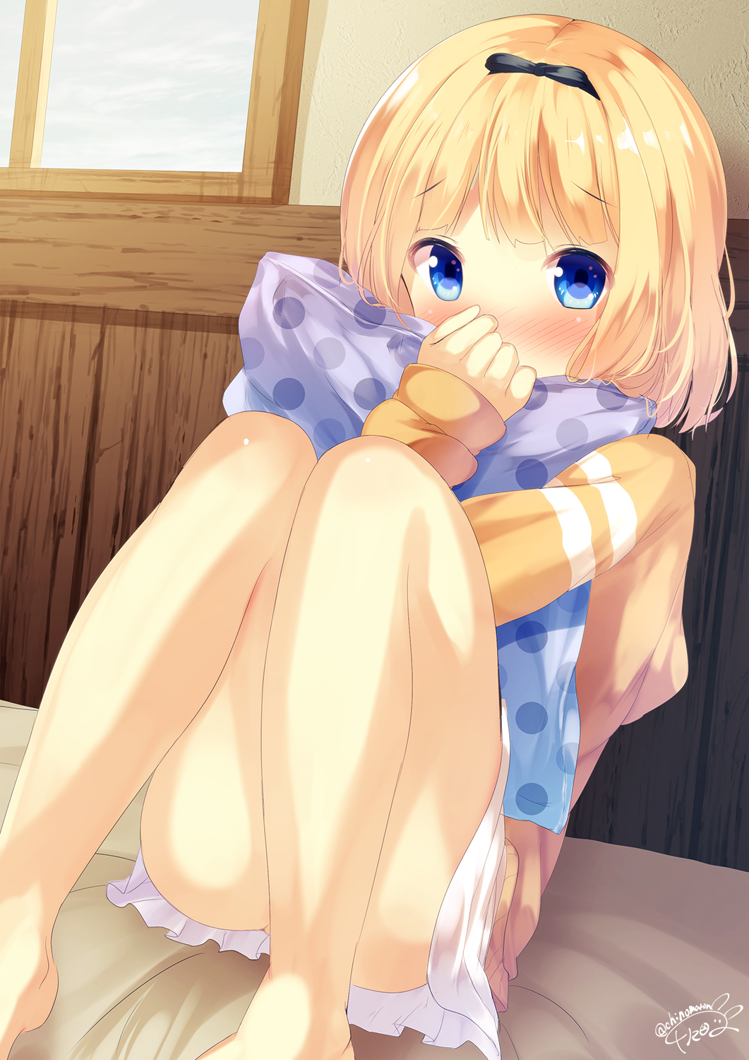 bangs bare_legs barefoot bed_sheet blonde_hair blue_eyes blue_sky blush chinomaron cloud cloudy_sky commentary covered_mouth day eyebrows_visible_through_hair feet_out_of_frame gochuumon_wa_usagi_desu_ka? highres hood hood_down hoodie indoors kirima_sharo looking_at_viewer nose_blush pillow pillow_hug pleated_skirt polka_dot polka_dot_pillow signature sitting skirt sky solo white_skirt window wooden_wall yellow_hoodie