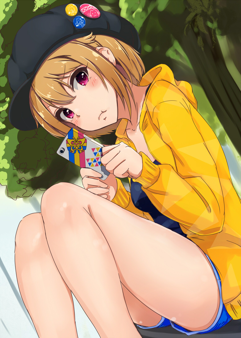 :t badge banana_(hirane1988) bangs bare_legs black_hat blue_shirt blue_shorts blurry blurry_background blush brown_hair button_badge cabbie_hat cellphone closed_mouth collarbone commentary_request day dutch_angle eyebrows_visible_through_hair feet_out_of_frame from_below hair_between_eyes hands_up hat head_tilt holding holding_cellphone holding_phone hood hood_down hooded_jacket ibuki_tsubasa idolmaster idolmaster_million_live! idolmaster_million_live!_theater_days jacket knees_together_feet_apart long_sleeves looking_at_viewer looking_down open_clothes open_jacket outdoors phone pout purple_eyes shirt short_hair shorts sitting sleeves_past_wrists smartphone solo thighs tree yellow_jacket