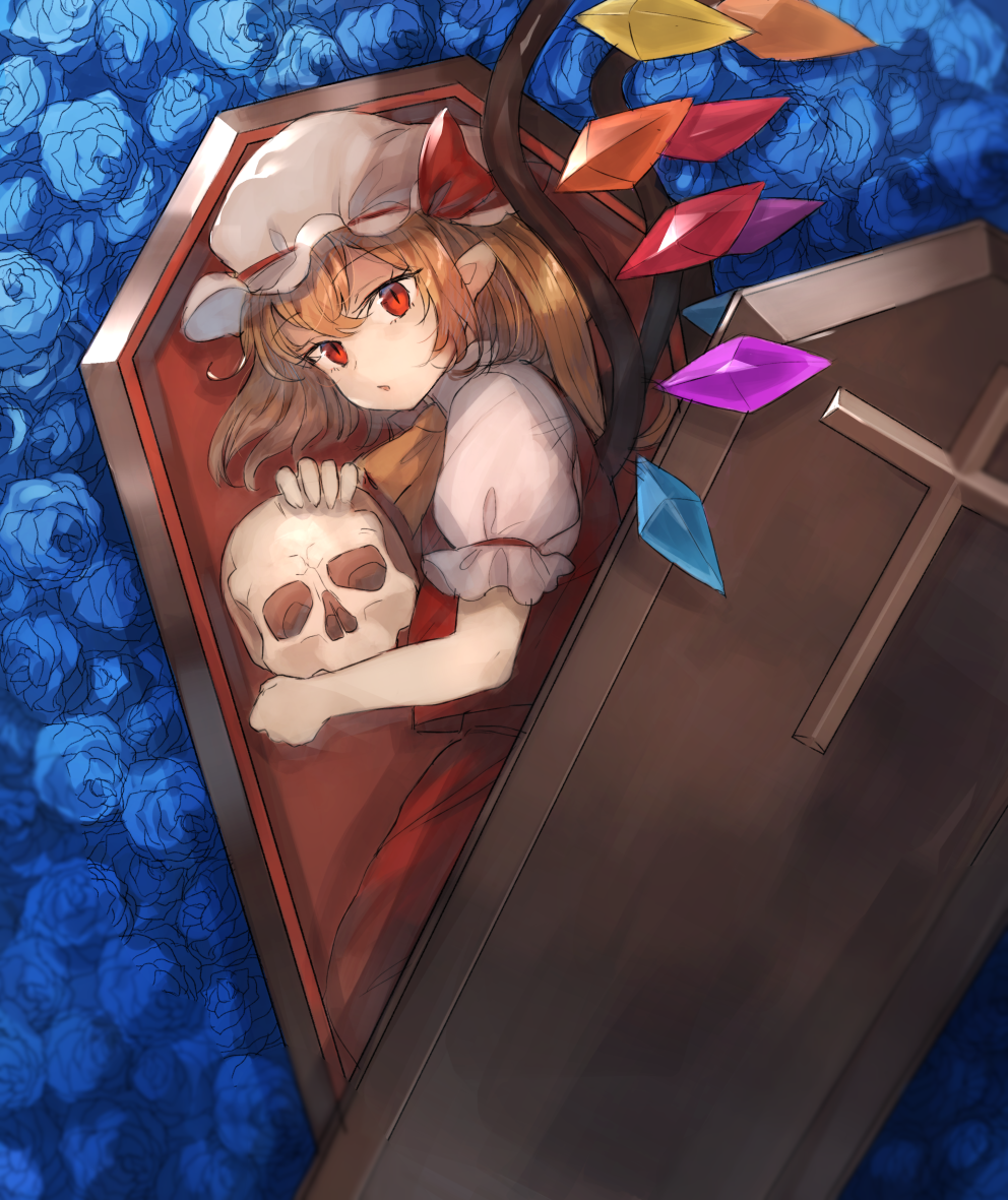 ascot bangs blonde_hair blue_flower blue_rose coffin commentary_request cross crystal eyebrows_visible_through_hair eyelashes flandre_scarlet flower from_above hair_between_eyes hat hat_ribbon holding holding_skull in_container kasuka_(kusuki) looking_at_viewer lying mob_cap on_side one_side_up parted_lips pointy_ears puffy_short_sleeves puffy_sleeves red_eyes red_ribbon red_skirt red_vest ribbon rose shirt short_sleeves skirt skirt_set skull slit_pupils solo touhou vest white_hat white_shirt wing_collar wings yellow_neckwear