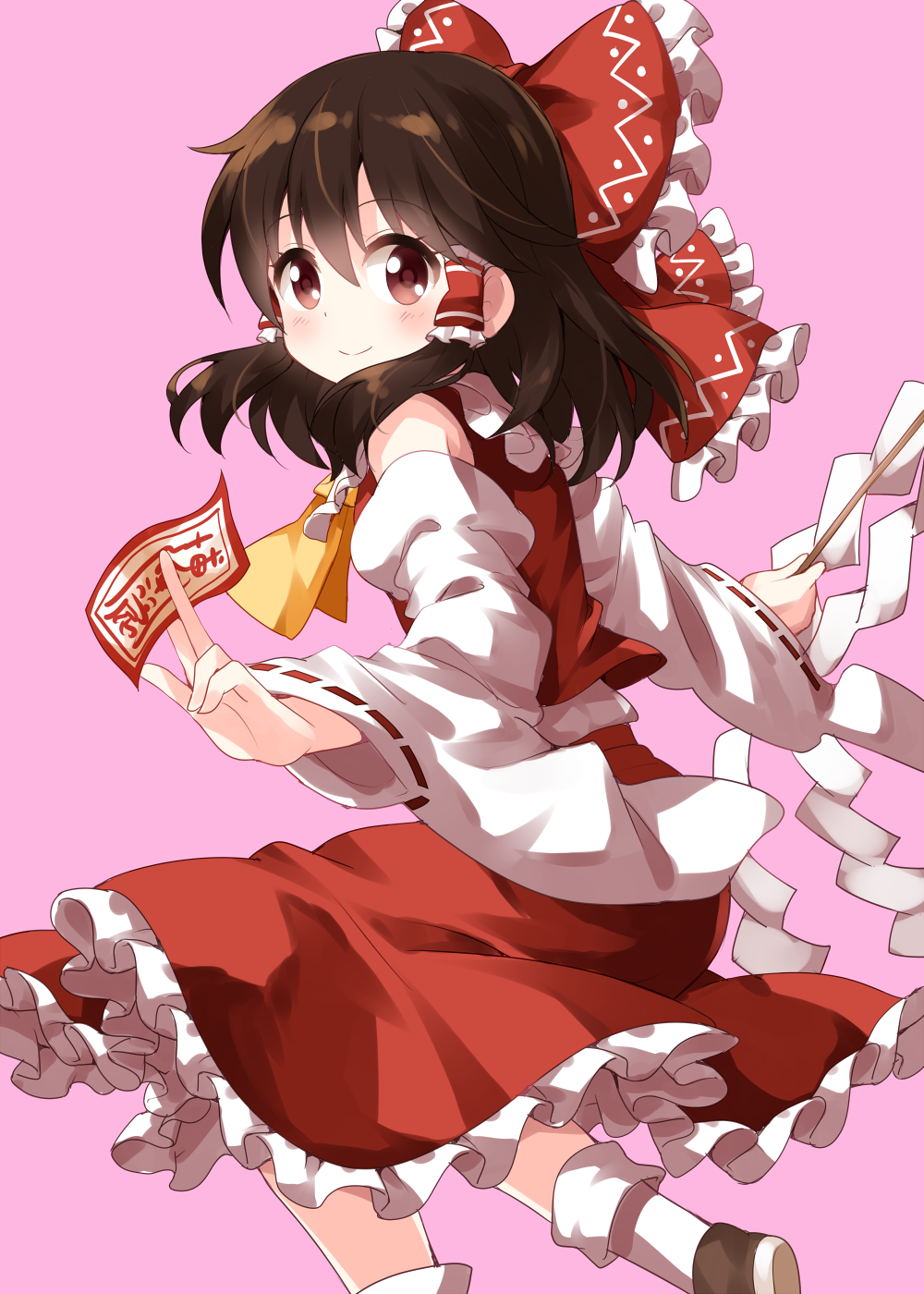 bow brown_eyes brown_hair commentary detached_sleeves frilled_bow frilled_skirt frills gohei hair_between_eyes hair_bow hair_tubes hakurei_reimu highres long_hair looking_at_viewer ofuda pink_background red_skirt ruu_(tksymkw) simple_background skirt smile solo touhou