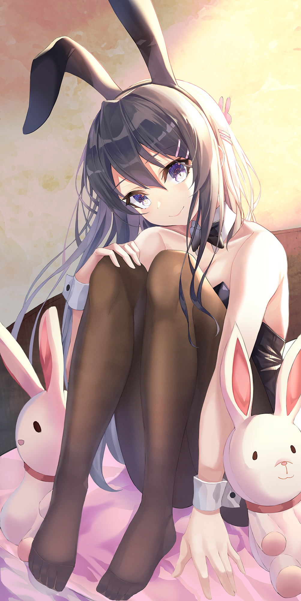 1girl animal_ears arm_support ass backlighting bare_arms bare_shoulders bed black_bunny_ears black_hair black_hairband black_leotard black_neckwear bow bowtie breasts brown_legwear bunny_ears bunny_girl bunny_hair_ornament bunnysuit cleavage closed_mouth collarbone commentary_request detached_collar eyebrows_visible_through_hair fake_animal_ears feet female fine_fabric_emphasis full_body hair_between_eyes hair_ornament hairband hairclip hand_on_own_knee head_tilt highres indoors knees_up legs leotard long_hair looking_at_viewer minin982 no_shoes on_bed pantyhose purple_eyes sakurajima_mai seishun_buta_yarou sidelocks sitting slit_pupils smile solo strapless strapless_leotard stuffed_animal stuffed_bunny stuffed_toy very_long_hair wrist_cuffs