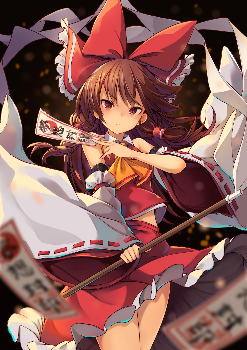 .sin 1girl ascot black_background blurry bow brown_hair closed_mouth cowboy_shot depth_of_field detached_sleeves expressionless floating_hair gohei hair_bow hair_tubes hakurei_reimu highres holding long_hair looking_at_viewer ofuda red_bow red_eyes red_skirt red_vest ribbon-trimmed_sleeves ribbon_trim shide skirt skirt_set solo touhou vest wide_sleeves yellow_neckwear