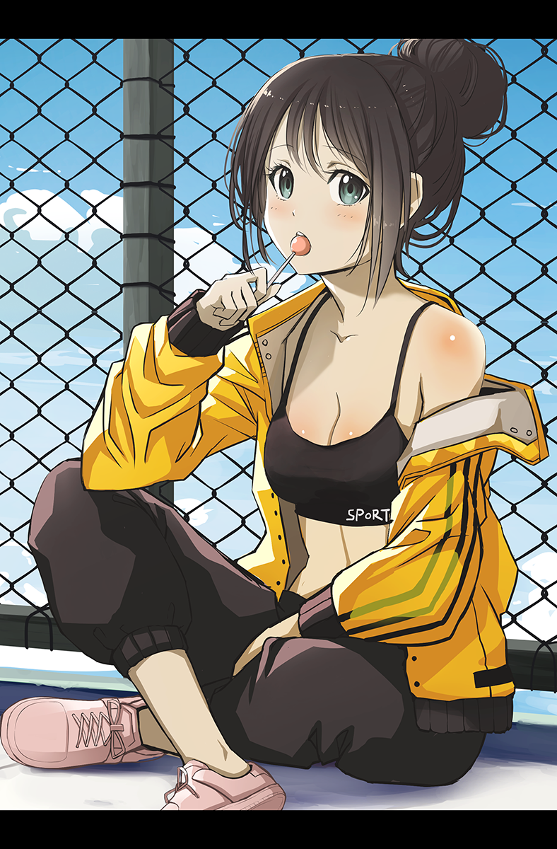 1girl bangs bare_shoulders black_hair black_pants blush breasts candy chain-link_fence cleavage collarbone crossed_legs day eyebrows_visible_through_hair fence food green_eyes hair_bun highres holding holding_candy holding_food holding_lollipop jacket jchoy letterboxed lollipop long_sleeves looking_at_viewer medium_breasts no_socks off_shoulder open_clothes open_jacket original outdoors pants pink_footwear shoes sidelocks sitting sleeves_past_wrists solo track_jacket upper_teeth yellow_jacket