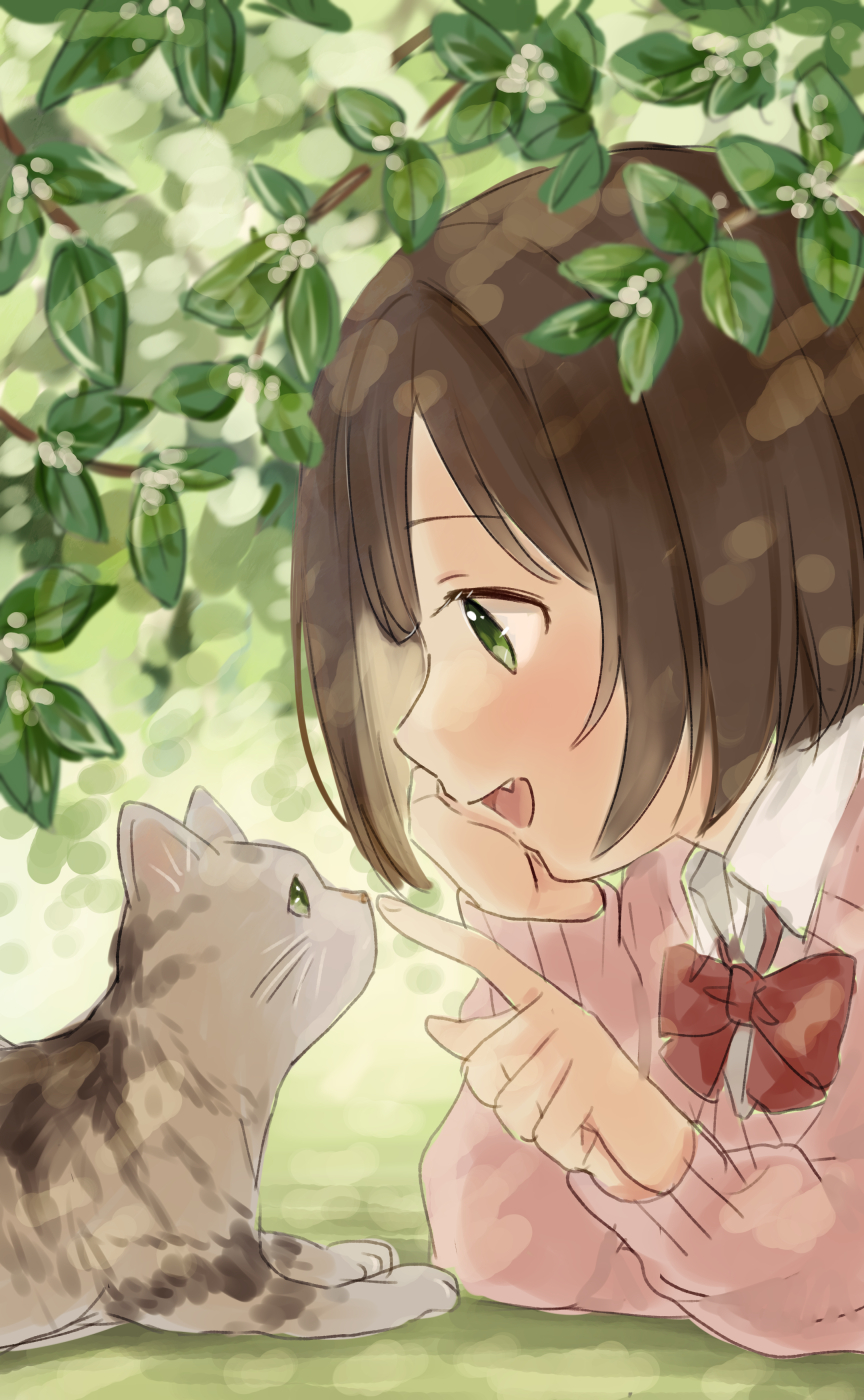 1girl blush bow bowtie brown_hair bush cardigan cat dappled_sunlight fang green_eyes hand_on_own_face head_rest highres idolmaster idolmaster_cinderella_girls idolmaster_cinderella_girls_starlight_stage index_finger_raised long_sleeves looking_at_another lying maekawa_miku on_grass on_stomach open_mouth pink_cardigan red_bow red_bowtie shirt short_hair smile solo staring sunlight tori_ririisu white_shirt