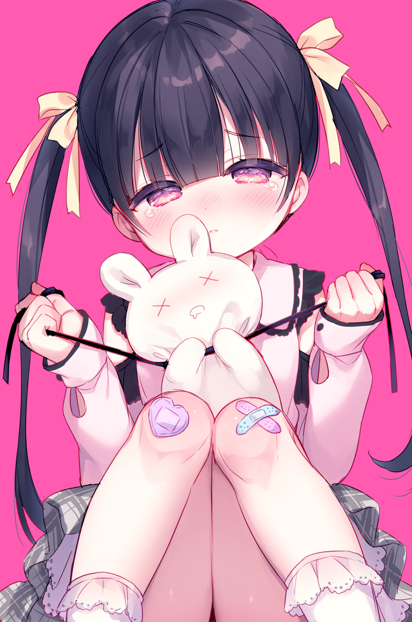 1girl bandaid bandaid_on_knee bandaid_on_leg bangs black_hair blush bow closed_mouth collared_shirt commentary_request crossed_bandaids eyebrows_visible_through_hair feet_out_of_frame frilled_legwear grey_skirt hair_bow half-closed_eyes head_tilt highres holding knees_together_feet_apart knees_up long_hair long_sleeves nose_blush original pink_background plaid plaid_skirt puffy_long_sleeves puffy_sleeves purple_eyes shirt simple_background sitting skirt sleeves_past_wrists socks solo strangling stuffed_animal stuffed_bunny stuffed_toy tears twintails usashiro_mani very_long_hair white_legwear white_shirt yellow_bow