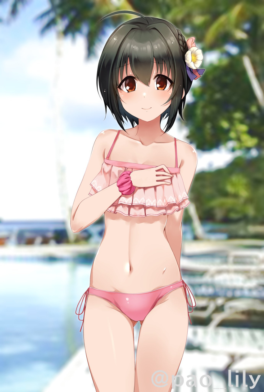 ahoge arm_behind_back ass_visible_through_thighs bangs black_hair blurry blurry_background brown_eyes collarbone commentary_request day eyebrows_visible_through_hair flower frilled_swimsuit frills hair_between_eyes hair_flower hair_ornament hand_on_own_chest highres idolmaster idolmaster_cinderella_girls kohinata_miho light_blush looking_at_viewer navel outdoors paopao pink_swimsuit short_hair sidelocks smile solo stomach swimsuit thighs twitter_username