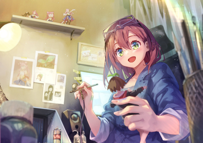 1girl airbrush bangs blue_jacket blurry blurry_background blurry_foreground blush breasts brown_hair chair cleavage eva_mashiro eva_mashiro_(vtuber) figure goggles goggles_on_head green_eyes grey_shirt highres holding indie_virtual_youtuber indoors jacket lamp long_sleeves medium_hair monitor open_mouth original shirt sitting sleeves_rolled_up smile solo speaker spray_can upper_body