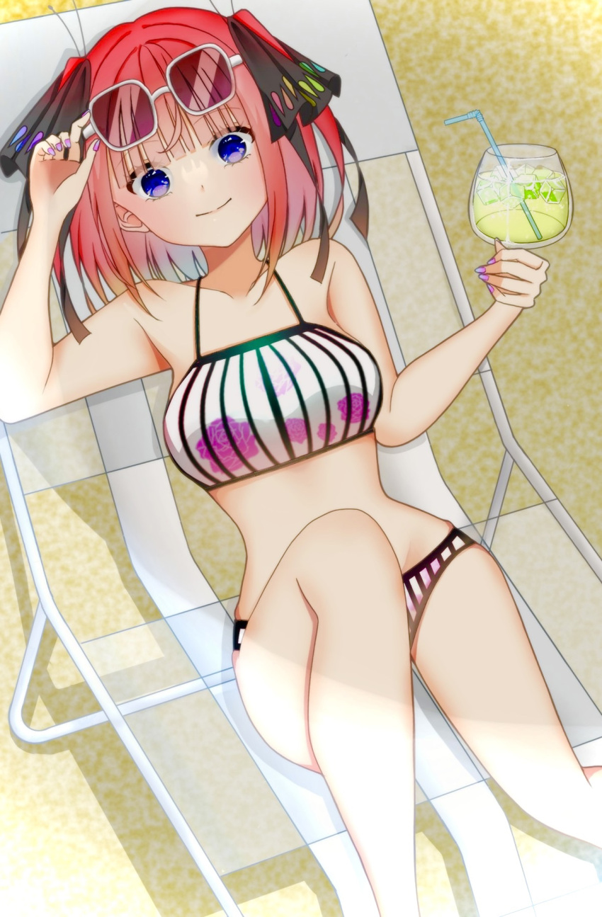 1girl bare_shoulders beach_chair bikini blue_eyes breasts chair cleavage closed_mouth cup drink drinking_glass drinking_straw eyewear_on_head go-toubun_no_hanayome hair_ornament hair_ribbon highres ice ice_cube large_breasts looking_at_viewer midriff nail_polish nakano_nino red_hair ribbon shade sitting smile solo sunbathing sunglasses sunlight swimsuit tanning user_ceda7825