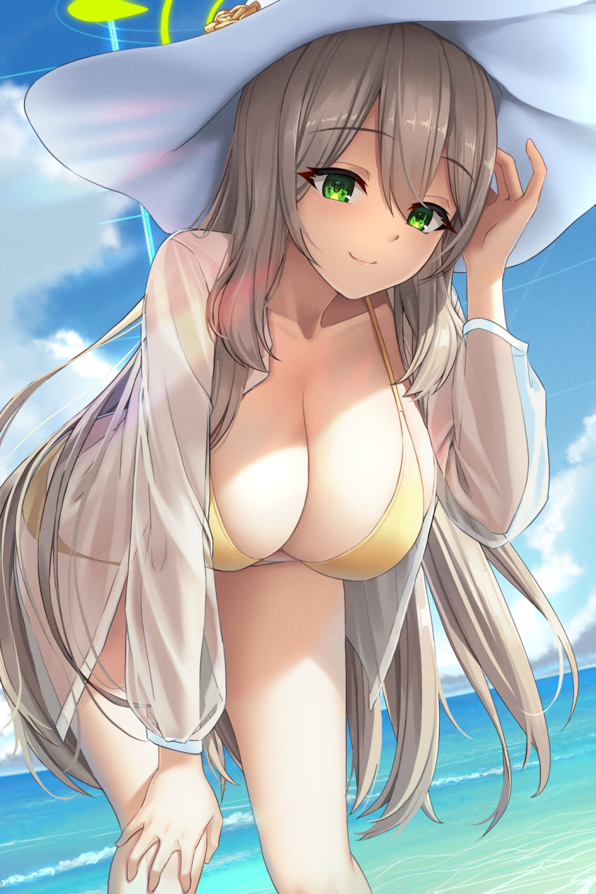 1girl azure-maya bangs beach bent_over bikini blonde_hair blue_archive blue_sky breasts closed_mouth cloud green_eyes halo hand_on_own_knee hand_up hat highres large_breasts long_hair looking_down nonomi_(blue_archive) nonomi_(swimsuit)_(blue_archive) ocean see-through see-through_shirt shirt sky smile solo sun_hat swimsuit thighhighs very_long_hair white_shirt yellow_bikini