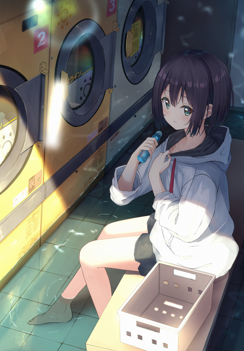 1girl bangs barefoot bench black_hair black_shorts bottle collarbone commentary_request drawstring enuni green_eyes hair_between_eyes highres holding holding_bottle hood hood_down hoodie indoors long_sleeves on_bench original ramune shallow_water short_shorts shorts sitting solo washing_machine water white_hoodie