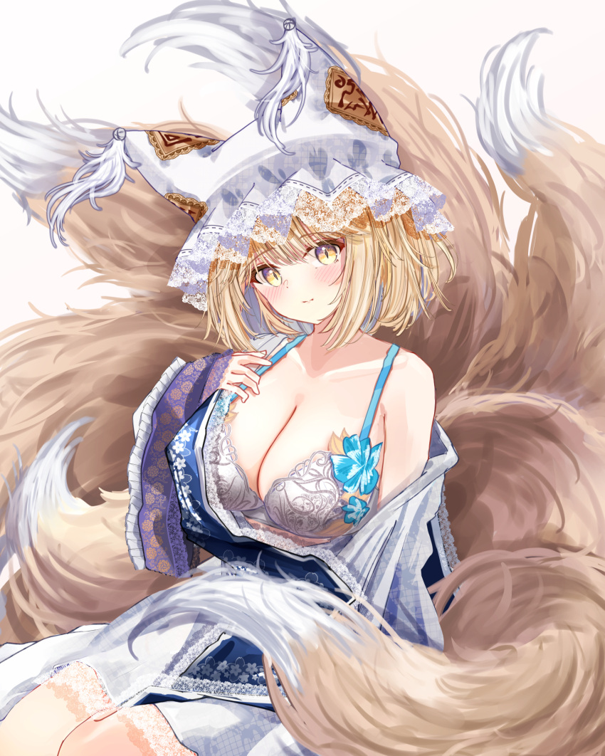 1girl animal_ear_headwear blonde_hair blue_tabard blush breasts cleavage collarbone dress fox_tail hat highres kitsune kyuubi lace-trimmed_dress lace-trimmed_headwear lace_trim large_breasts looking_at_viewer mob_cap multiple_tails sarasadou_dan simple_background single_bare_shoulder solo tabard tail touhou white_background white_dress wide_sleeves yakumo_ran yellow_eyes