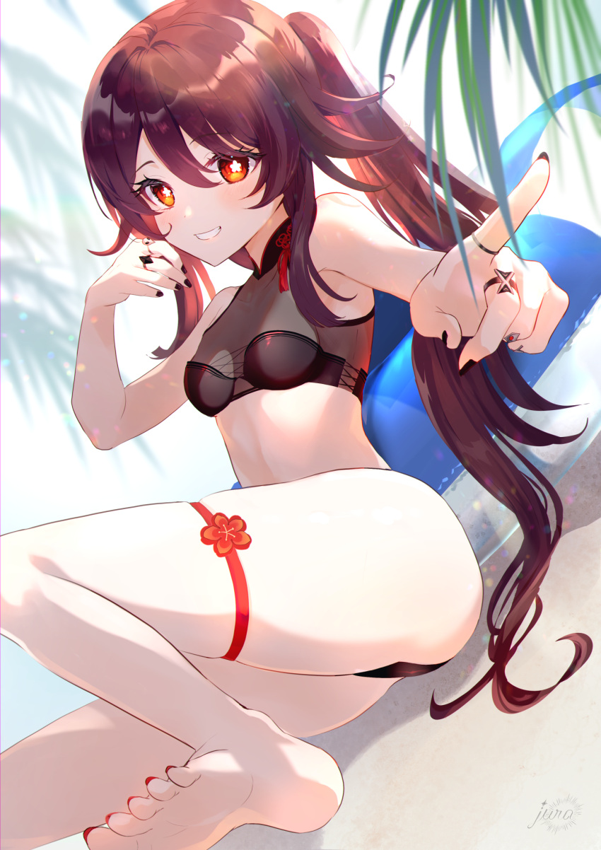 1girl bare_legs bare_shoulders barefoot beach bikini black_bikini black_nails breasts brown_hair genshin_impact highres hu_tao_(genshin_impact) innertube jewelry jura legs looking_at_viewer pointing red_eyes ring sitting small_breasts smile soles solo swimsuit symbol-shaped_pupils thigh_strap thighs toes