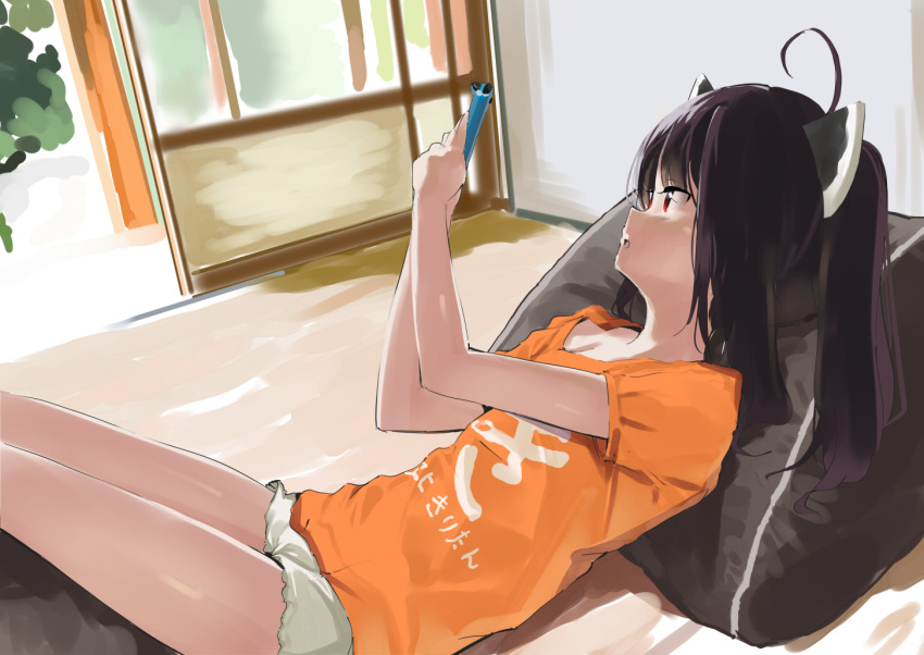 1girl ahoge black_hair cellphone clothes_writing commentary_request hands_up headgear holding holding_phone indoors lamb_(hitsujiniku) looking_away orange_shirt parted_lips phone pillow red_eyes shirt short_shorts short_sleeves shorts solo touhoku_kiritan translation_request twintails voiceroid white_shorts