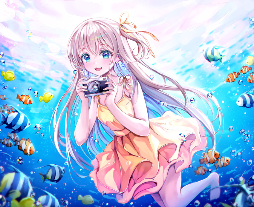 1girl :d air_bubble bangs bare_shoulders barefoot blue_eyes blush bubble butterflyfish camera clownfish dress eyelashes fingernails fish frilled_dress frills grey_hair hair_between_eyes hair_ornament hair_ribbon hands_up highres holding holding_camera long_hair looking_at_viewer nail_polish one_side_up open_mouth original ribbon sidelocks sleeveless sleeveless_dress smile solo ssum_(ehf_dustk) sundress teeth underwater upper_teeth very_long_hair water yellow_dress yellow_nails yellow_ribbon