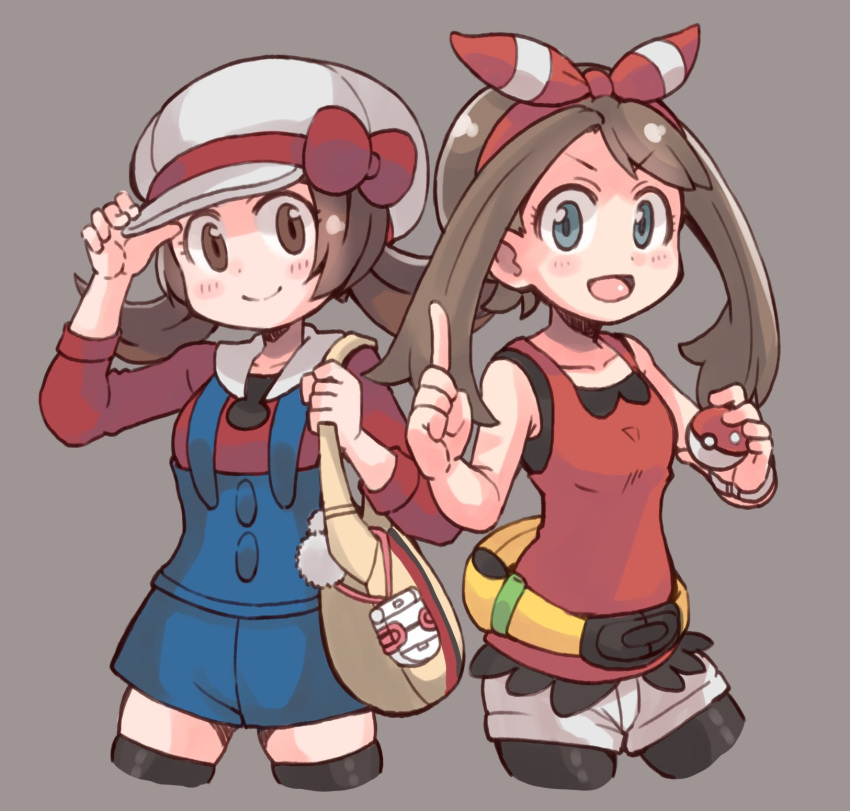 2girls bag bangs bike_shorts bike_shorts_under_shorts black_thighhighs blue_eyes bow bow_hairband brown_eyes brown_hair cropped_legs es_(eisis) grey_background hairband hat hat_bow highres holding holding_bag holding_poke_ball index_finger_raised long_sleeves looking_at_viewer low_twintails lyra_(pokemon) may_(pokemon) multiple_girls open_mouth overalls poke_ball pokegear pokemon pokemon_(game) pokemon_hgss pokemon_oras red_bow shorts simple_background smile tank_top thighhighs twintails white_headwear white_shorts