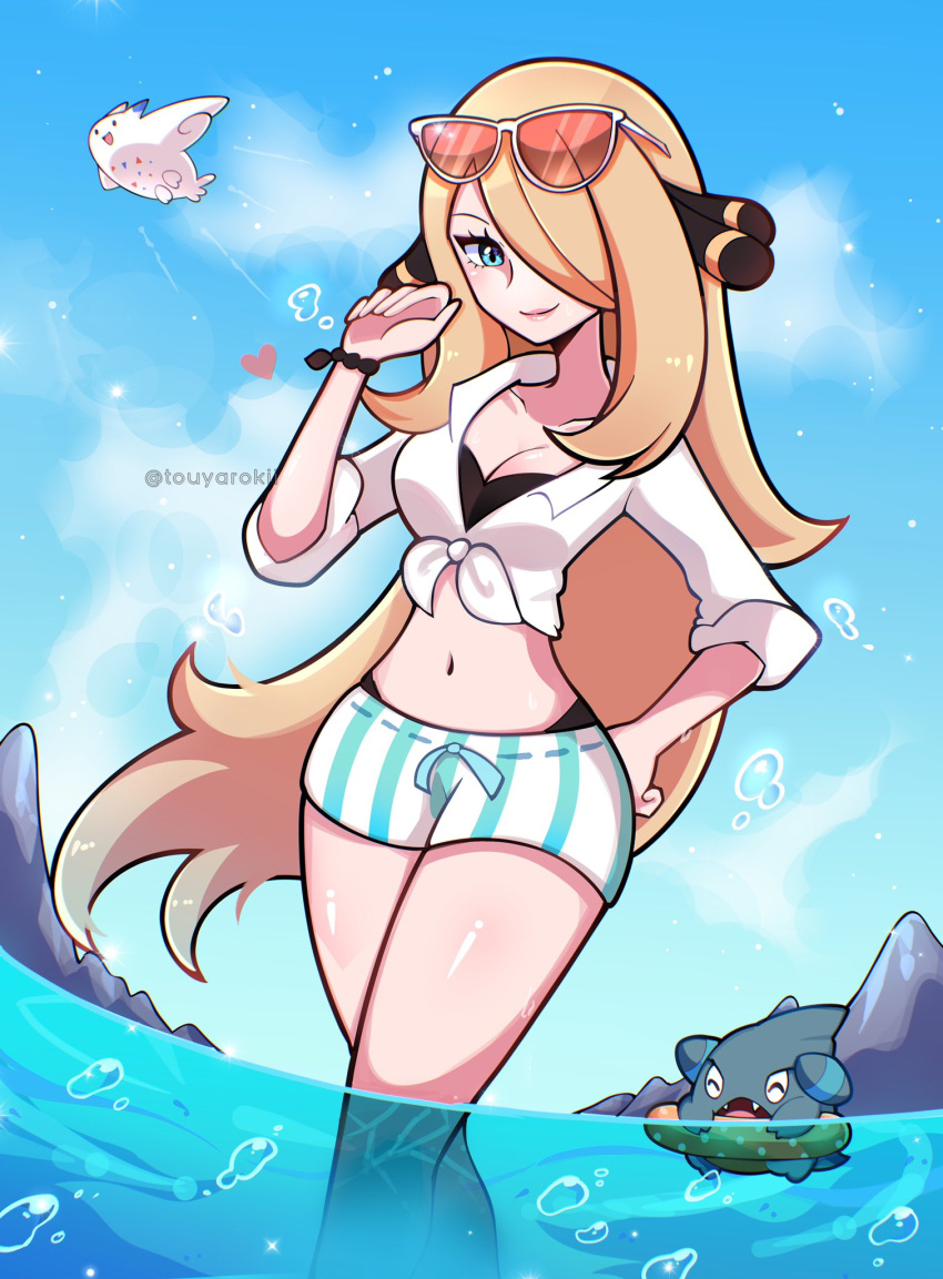 1girl alternate_eye_color bikini bikini_under_clothes black_bikini blonde_hair blue_eyes blue_sky bracelet breasts bubble cleavage closed_mouth cloud crop_top cynthia_(pokemon) day dolphin_shorts eyewear_on_head gible hair_ornament hair_over_one_eye hand_on_hip hand_up heart highres innertube jewelry large_breasts lips long_hair long_sleeves looking_at_viewer outdoors pokemon pokemon_(game) pokemon_dppt shirt short_shorts shorts sky sleeves_rolled_up smile striped striped_shorts sunglasses swimsuit tied_shirt togekiss touyarokii twitter_username very_long_hair wading water white_shirt