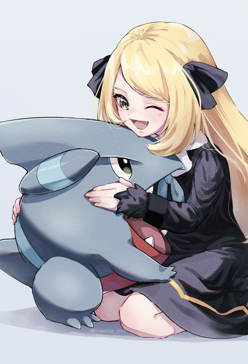 1girl ;d bangs black_dress black_ribbon blonde_hair commentary_request cynthia_(pokemon) dress eyelashes gible hair_ribbon happy highres hokka_tm holding holding_pokemon long_hair long_sleeves one_eye_closed open_mouth pokemon pokemon_(anime) pokemon_(creature) pokemon_journeys ribbon sitting smile tongue yellow_eyes younger