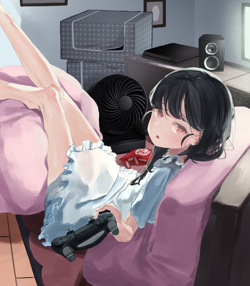 1girl :o absurdres bangs bare_legs bean_bag_chair black_hair blue_dress blunt_bangs bright_pupils controller dot_nose dress electric_fan food framed_image frilled_dress frills game_console game_controller highres holding holding_controller holding_game_controller indoors kitkat legs_up long_hair looking_at_viewer monitor nano_illustrator original parted_lips playstation_4 playstation_controller red_eyes sitting solo speaker white_pupils