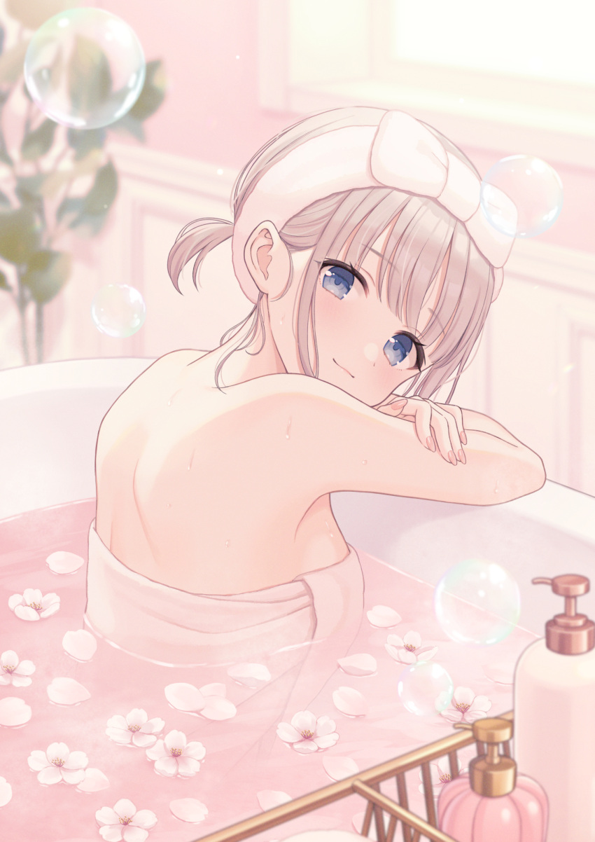 1girl bare_arms bare_shoulders bath bathing bathtub blue_eyes blurry blurry_background breasts brown_hair bubble closed_mouth commentary_request depth_of_field flower flower_on_liquid highres indoors looking_at_viewer looking_to_the_side naked_towel original partially_submerged shiromikan small_breasts smile solo towel upper_body water white_flower window