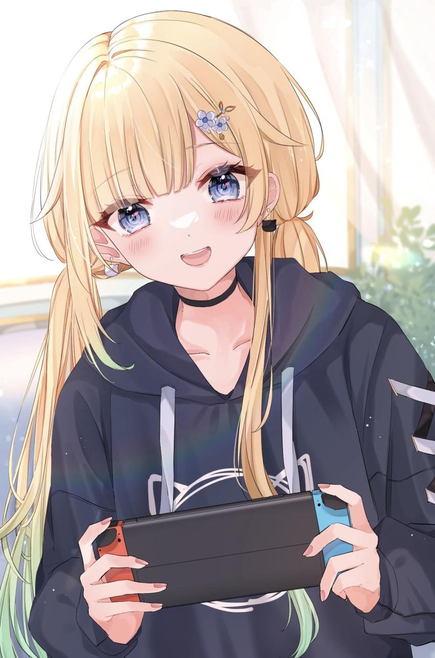1girl aizawa_ema blonde_hair blue_eyes blush breasts cat_earrings cleavage hair_ornament highres holding hood hoodie indoors long_hair nintendo_switch open_mouth pink_nails playing_games shain smile solo twintails virtual_youtuber vspo!
