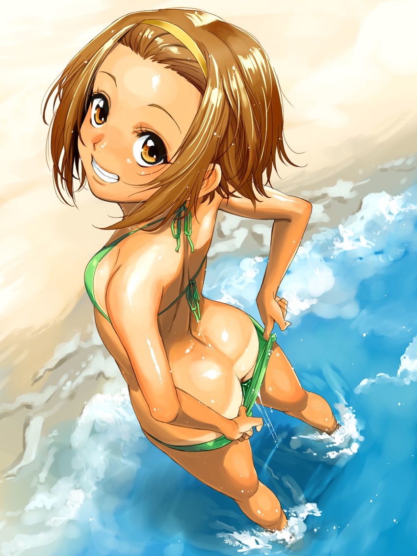 ass back bare_shoulders beach bikini bikini_pull bikini_tan breasts brown_eyes brown_hair day downpants dripping foreshortening from_above from_behind green_bikini grin hairband highres k-on! looking_at_viewer looking_back looking_up mumu ocean outdoors pulled_by_self shiny shiny_skin small_breasts smile solo swimsuit tainaka_ritsu tan tanline wading water wet wet_clothes