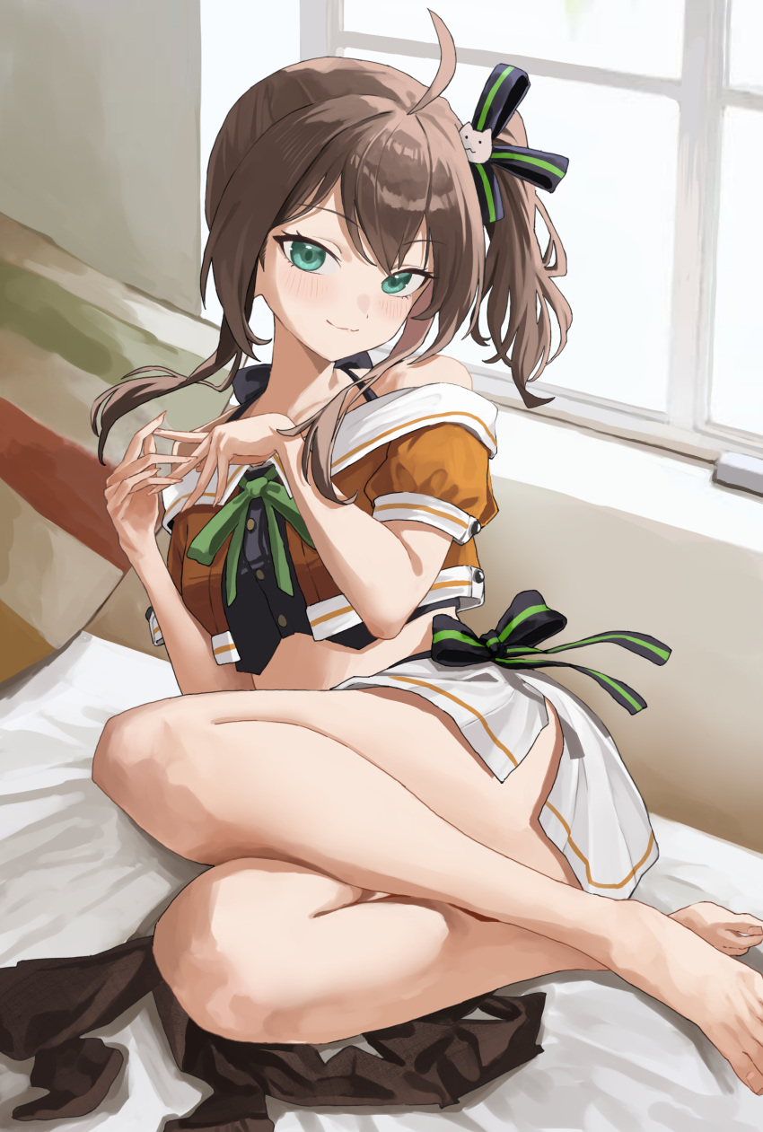 1girl ahoge art_mu barefoot brown_hair commentary_request crop_top green_eyes highres hololive indoors long_hair looking_at_viewer midriff natsuiro_matsuri natsuiro_matsuri_(1st_costume) on_bed orange_shirt pantyhose pleated_skirt shirt side_ponytail skirt solo unworn_pantyhose virtual_youtuber white_skirt window