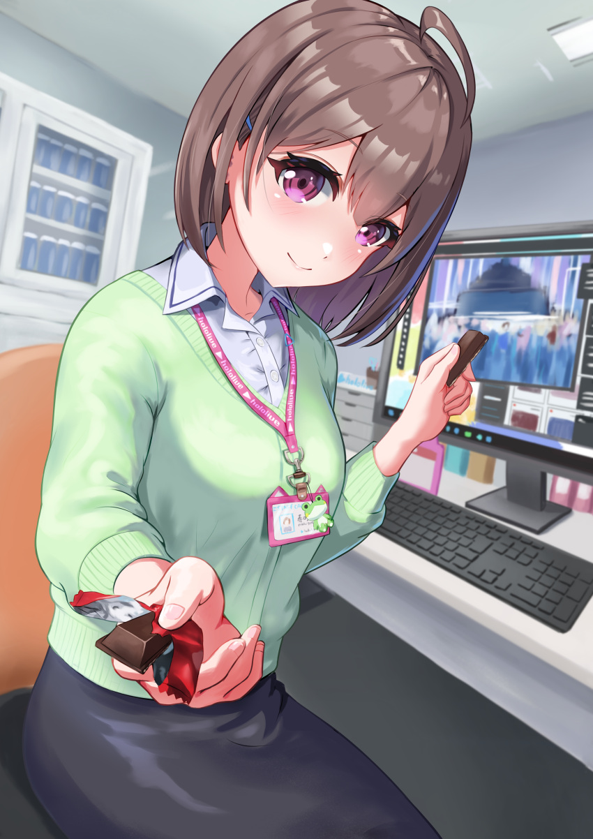 1girl absurdres black_skirt brown_hair collared_shirt food green_sweater harusaki_nodoka highres holding holding_food hololive id_card incoming_food isazawa kitkat lanyard looking_at_viewer monitor office_lady pink_eyes pov shirt sitting skirt smile solo sweater virtual_youtuber white_shirt