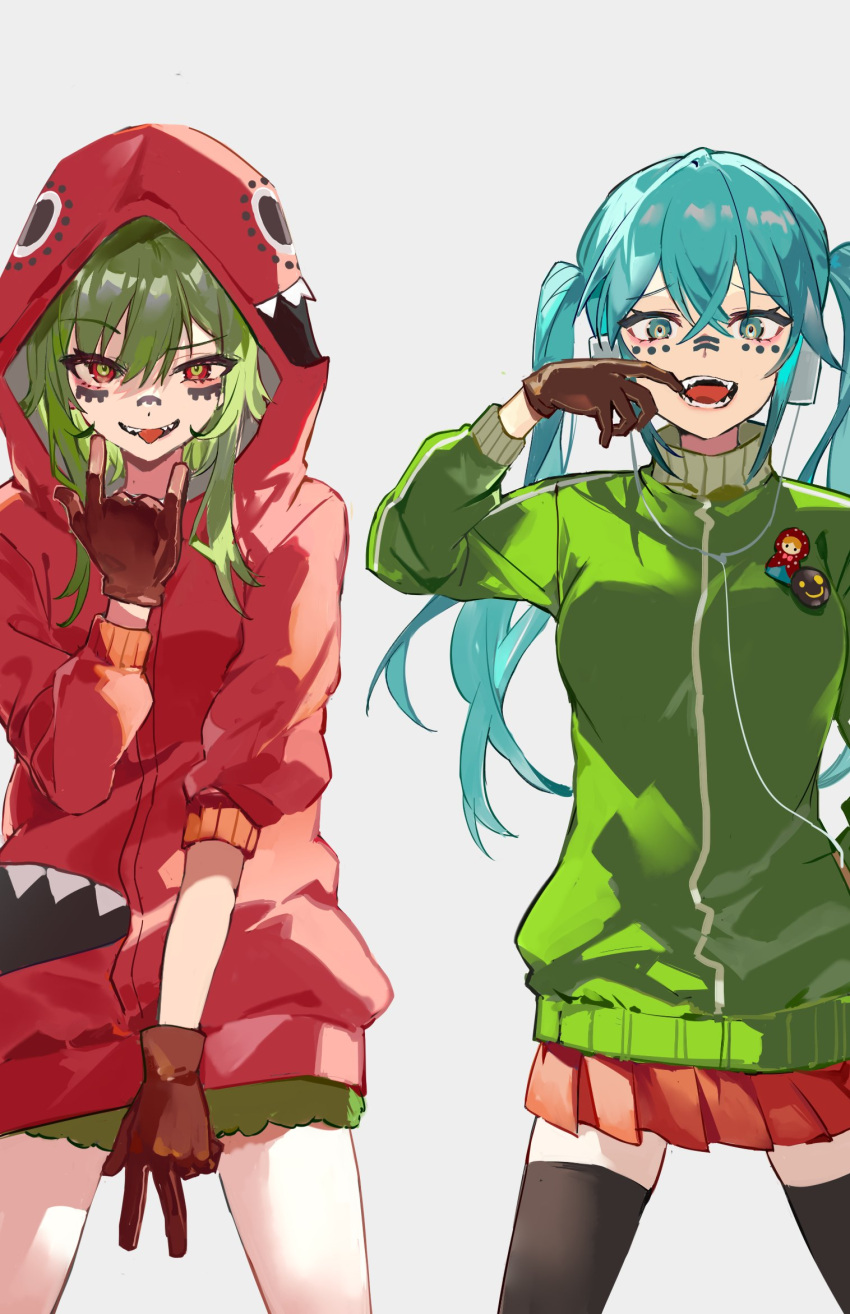 2girls \m/ black_thighhighs blue_eyes blue_hair brown_gloves commentary cowboy_shot facial_mark gloves green_hair green_jacket green_skirt gumi hatsune_miku headphones highres jacket karasu_btk long_hair matryoshka_(vocaloid) matryoshka_doll mouth_pull multiple_girls open_mouth pleated_skirt red_eyes red_jacket red_skirt short_hair simple_background skirt thighhighs tongue tongue_out twintails vocaloid w white_background