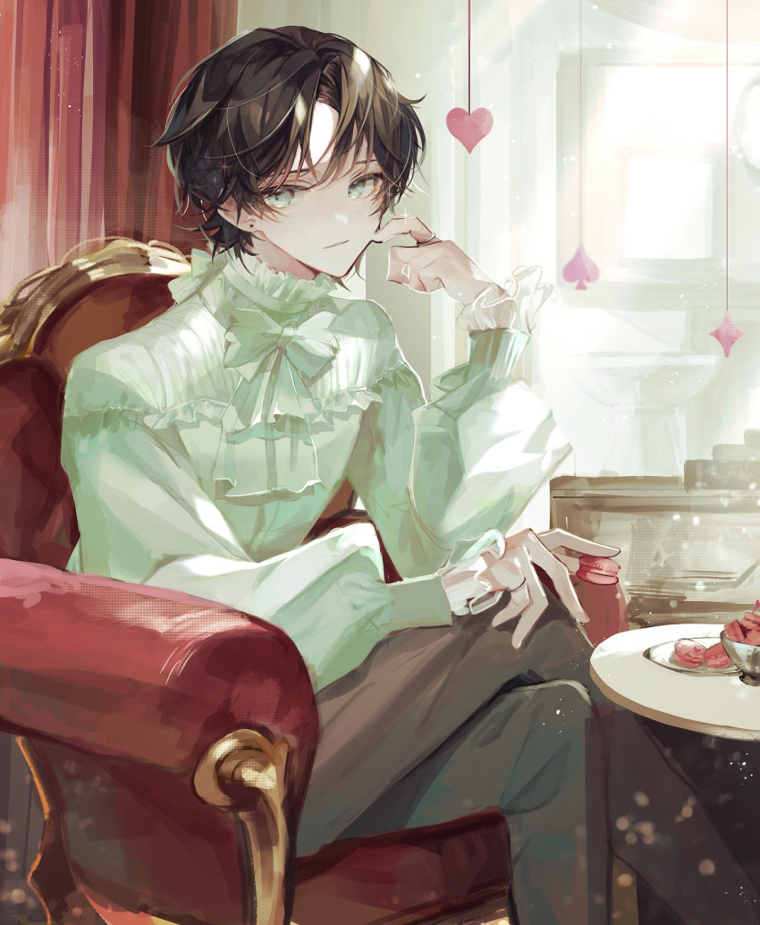 1boy aqua_eyes armchair bangs black_hair bow bowtie brown_pants chair crossed_legs earrings feet_out_of_frame food frilled_shirt_collar frills green_bow green_bowtie green_shirt hand_up heart highres holding holding_food indoors jewelry light_smile long_sleeves looking_at_viewer macaron male_focus original pants parted_bangs pinky_ring plate ring shirt short_hair sitting solo spade_(shape) stud_earrings table u-sama_(u_summer0719)