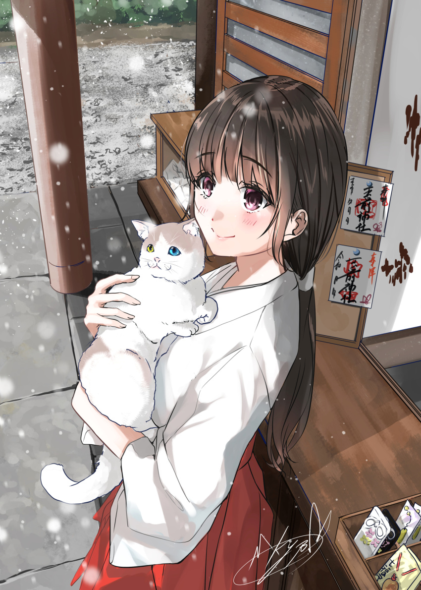 1girl animal bangs blush brown_hair bush cat closed_mouth commentary_request cowboy_shot day from_above highres holding holding_animal holding_cat house japanese_clothes kimono long_hair long_sleeves miko new_year omamori original outdoors ponytail purple_eyes red_skirt shirt sidelocks signature skirt smile snowing soragane_(banisinngurei) standing stone_floor white_cat white_kimono