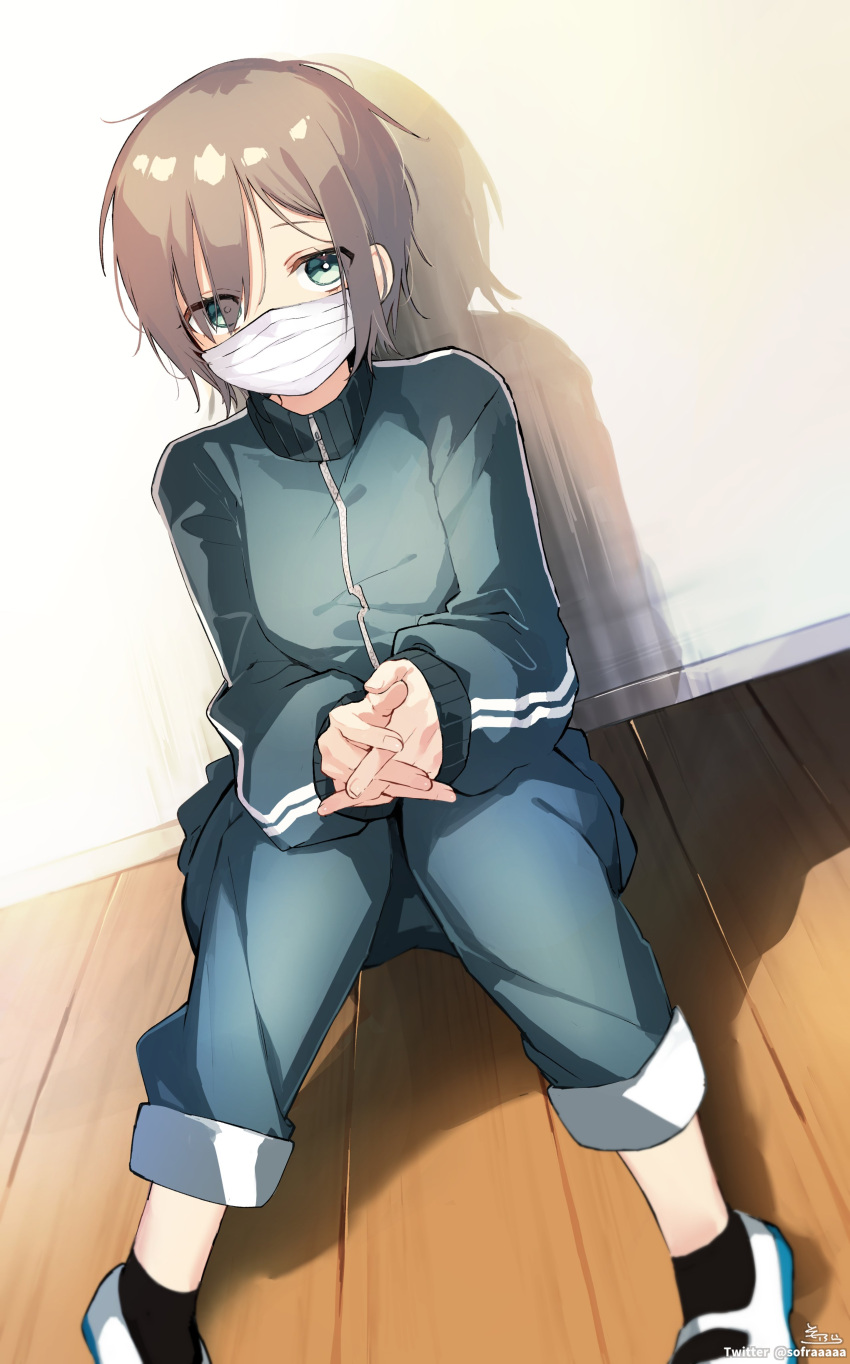 1girl absurdres bangs black_socks blue_jacket blue_pants brown_hair commentary_request eyes_visible_through_hair feet_out_of_frame green_eyes hair_over_one_eye highres jacket knees_together_feet_apart knees_up long_sleeves looking_at_viewer mask mouth_mask on_floor original own_hands_together pants puffy_long_sleeves puffy_sleeves shoes short_hair signature sitting sleeves_past_wrists socks sofra solo surgical_mask track_jacket track_pants track_suit twitter_username uwabaki white_footwear wooden_floor
