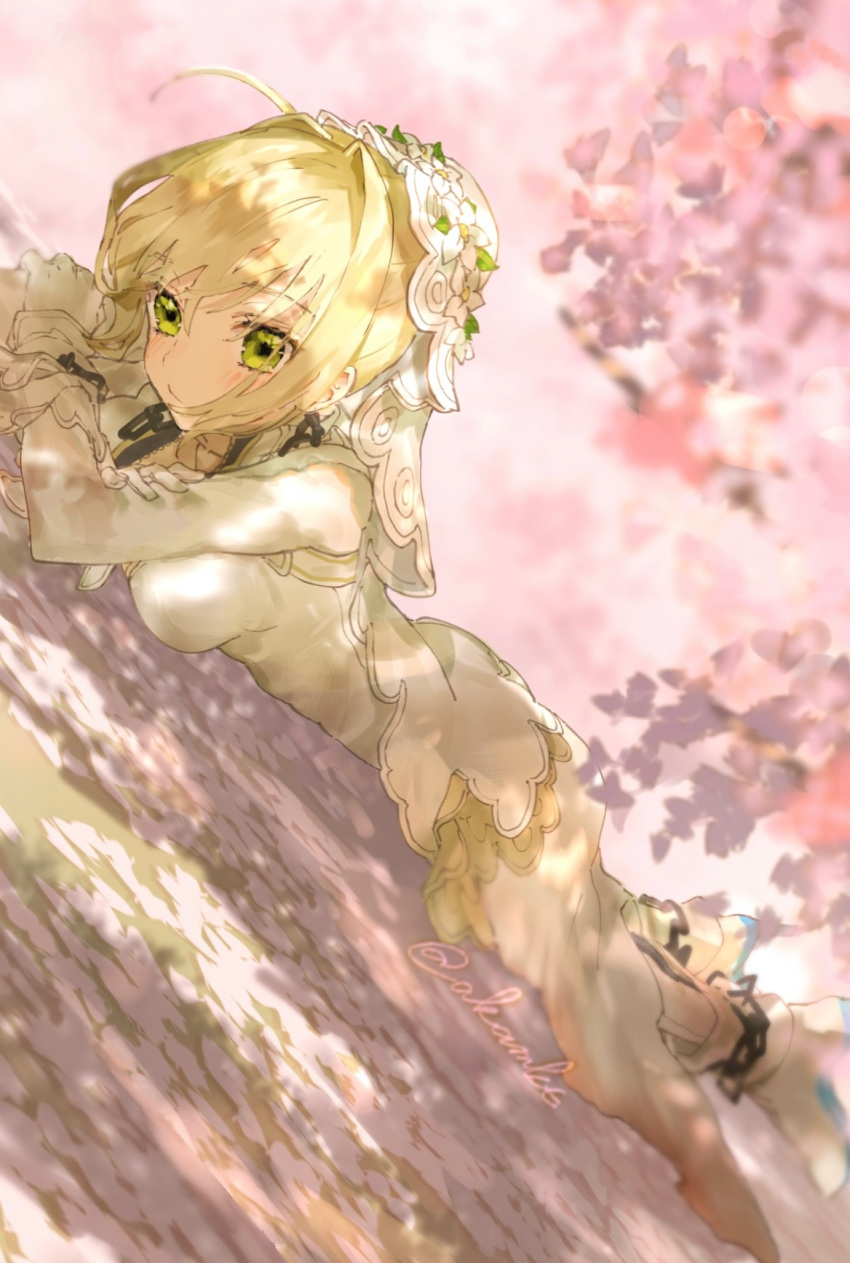 1girl ahoge akamakoto blonde_hair blush bodysuit breasts chain fate/extra fate/extra_ccc fate_(series) flower_wreath green_eyes hair_between_eyes hair_intakes head_wreath highres large_breasts lock long_hair looking_at_viewer lying nero_claudius_(bride)_(fate) nero_claudius_(fate) on_stomach padlock solo veil white_bodysuit