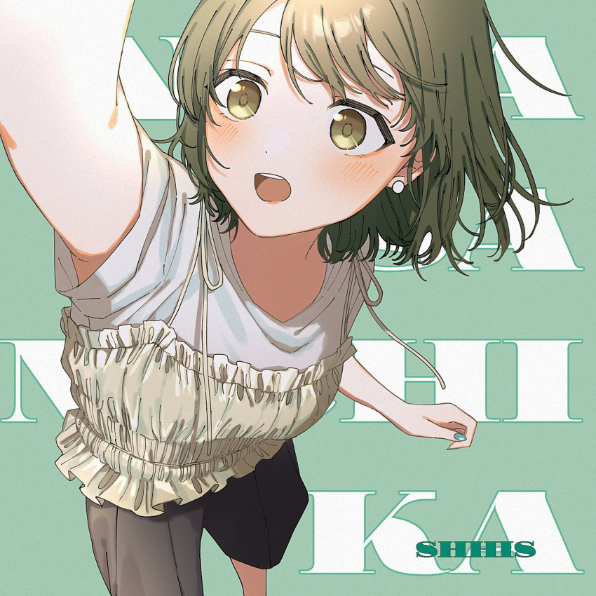 1girl :o arm_up black_shorts blush character_name clothing_request green_eyes green_hair highres idolmaster idolmaster_shiny_colors iwawa nanakusa_nichika shirt short_sleeves shorts simple_background solo text_background white_shirt