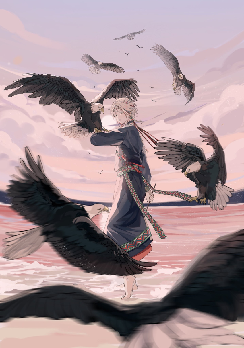 1boy androgynous animal animal_on_arm arm_at_side barefoot bird bird_on_arm blue_robe choker cloud commentary eagle earrings forehead_jewel from_behind gem grey_hair hair_ornament headband highres holding holding_stick horizon jewelry jyuroku_(blacksugar_16) landing light_particles long_sleeves looking_back male_focus motion_blur necklace ocean original outdoors red_gemstone robe sash shore short_hair sky standing stick sun symbol-only_commentary traditional_clothes twilight