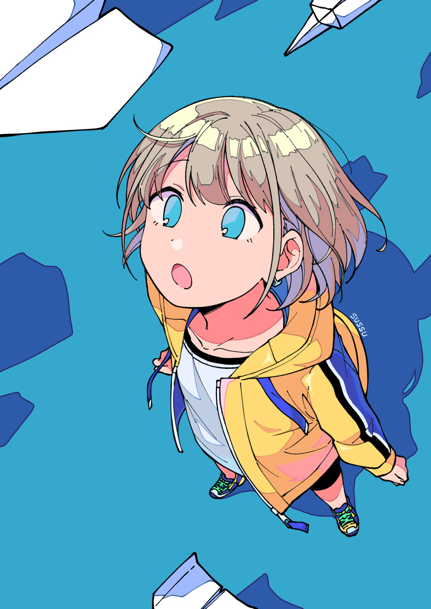1girl absurdres bike_shorts blue_background blue_eyes breasts collarbone dot_nose from_above full_body grey_hair highres hood hoodie idolmaster idolmaster_shiny_colors long_sleeves looking_at_another looking_up medium_breasts niyororinpayamaru open_clothes open_hoodie open_mouth paper_airplane serizawa_asahi shadow shirt shoes short_hair sneakers solo white_shirt yellow_hoodie