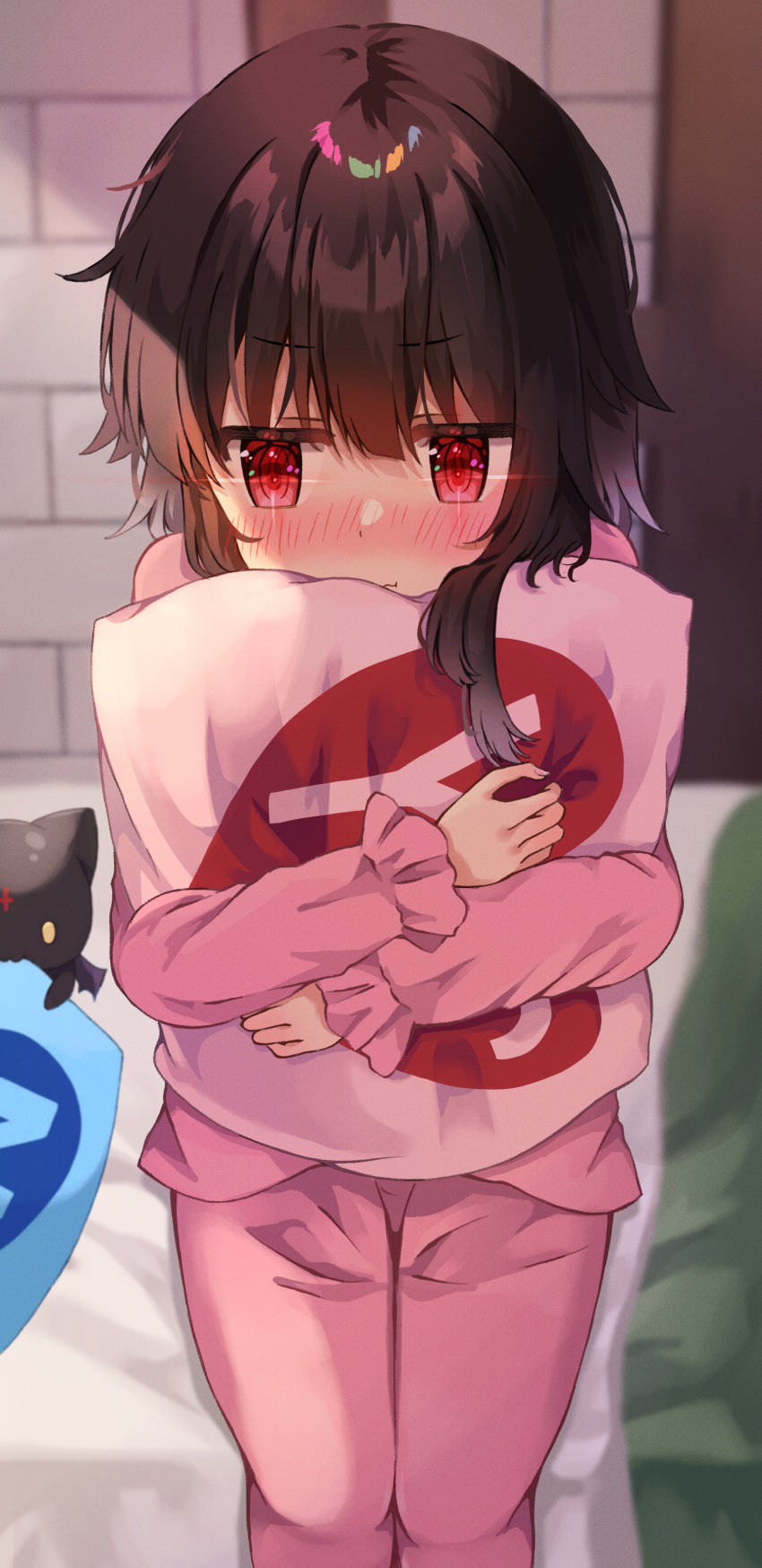 1girl absurdres bedroom blush brown_hair chomusuke commentary cowboy_shot highres holding holding_pillow hugging_object indoors kono_subarashii_sekai_ni_shukufuku_wo! long_sleeves looking_to_the_side megumin no on_bed pajamas pillow pillow_hug pink_pajamas pout red_eyes short_hair_with_long_locks sitting solo sparkling_eyes straight-on yes yes-no_pillow yuno_(suke_yuno)